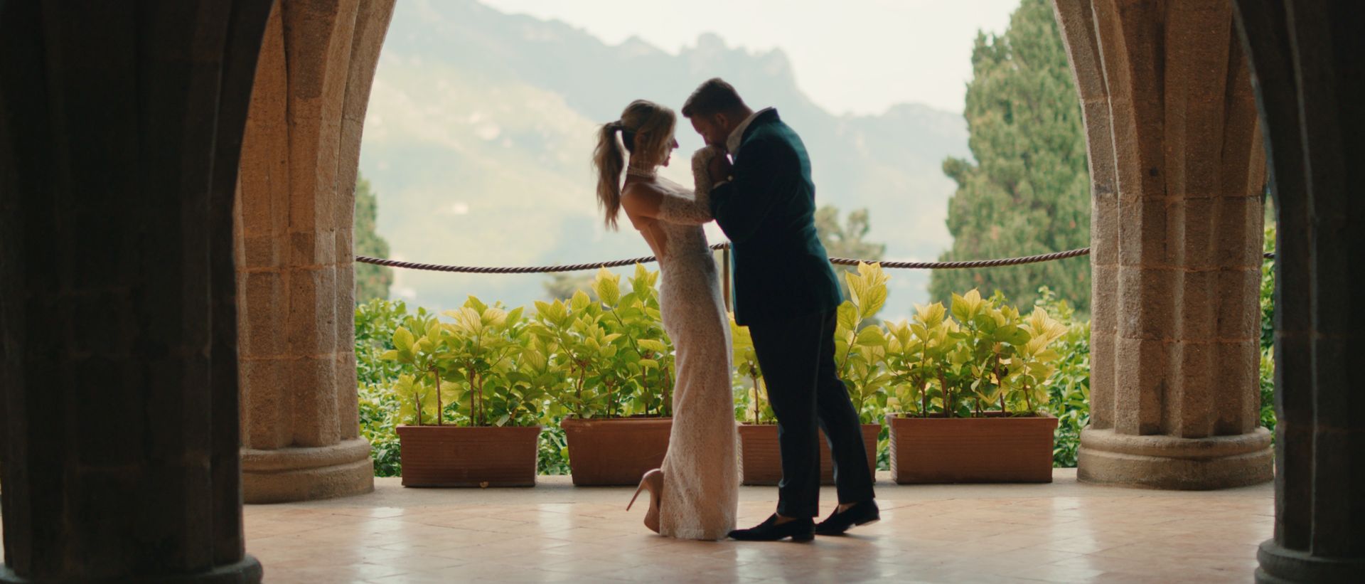Chelsea and Nicholas under the stone arches at Villa Cimbrone