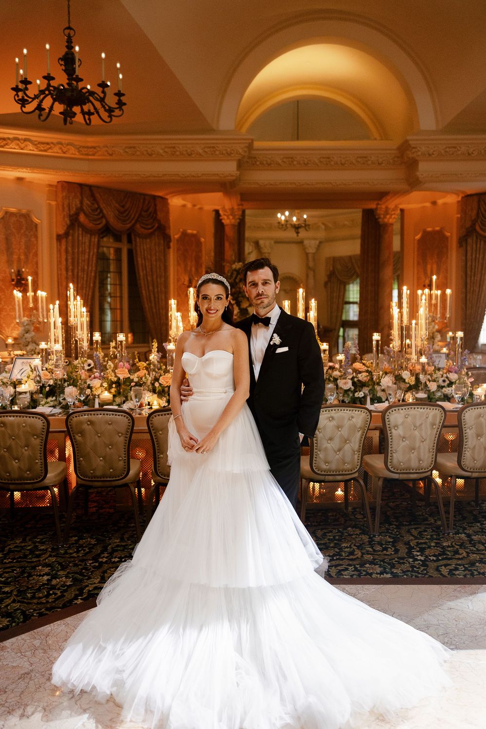 Stephanie and Jake in a candlelit ballroom