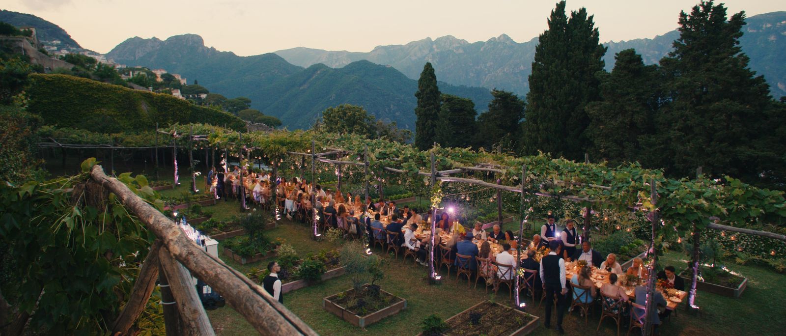 A candlelit garden dinner at Villa Cimbrone at dusk
